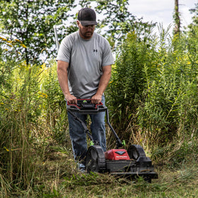 Earthquake 60V mower with 22-inch cutting head for wide, efficient mowing.