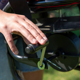 Comfort harness strap provides adjustable fit for extended spreading sessions.