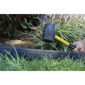 1-2 inches of EasyFlex edging visible above ground for a crisp line.