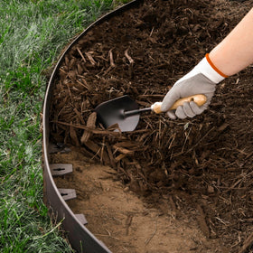 EasyFlex edging defines mulch and rock borders for tidy garden zones.