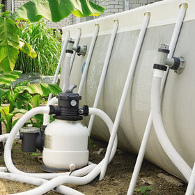 Hose beside a sand filter highlighting sand-filter compatibility.