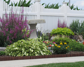 Eco-Green Wood border installed in yard creates neat, lasting edge.