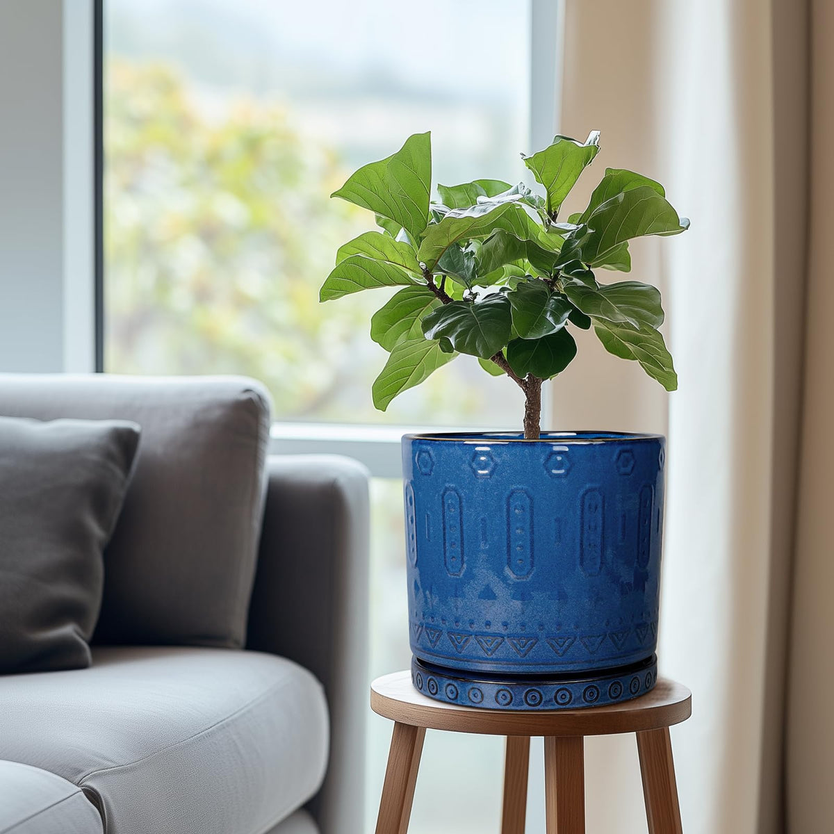 Eightpot blue ceramic plant saucer with geometric pattern enhances décor while guiding water away from pots.