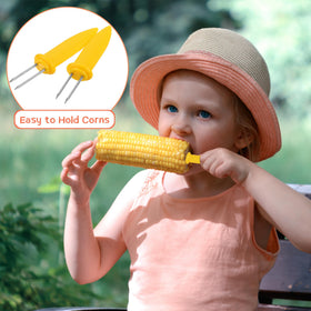 Barbecue scene with Elcoho corn holders at outdoor dining.