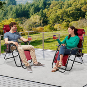 Red Elevon chairs in a beach setup demonstrate versatile outdoor seating.