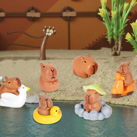 EMPHASISY mini garden capybaras adding whimsy to bonsai and potted plants.