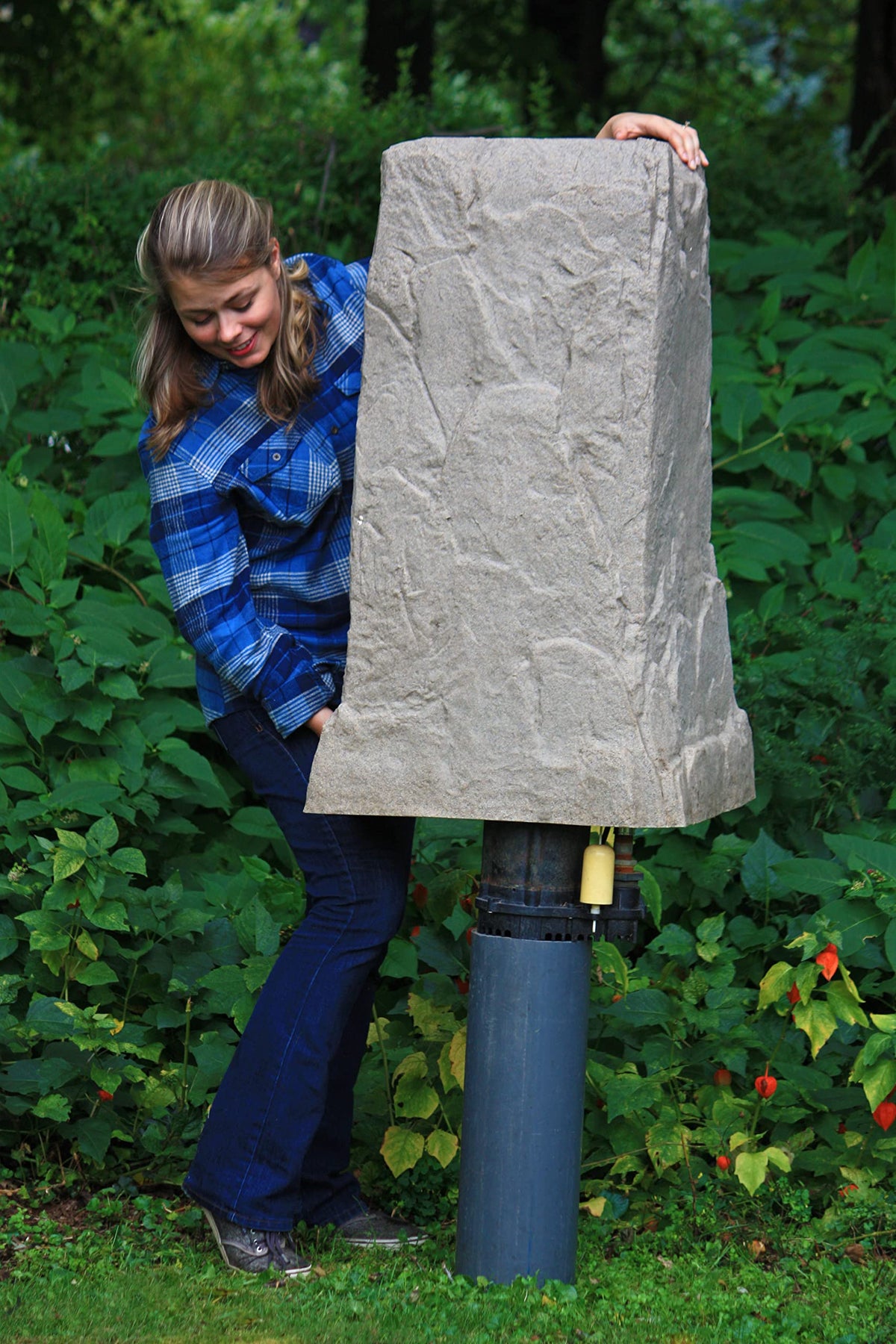 Emsco Group landscape rock tall monolith cover blends with lawns and paths.