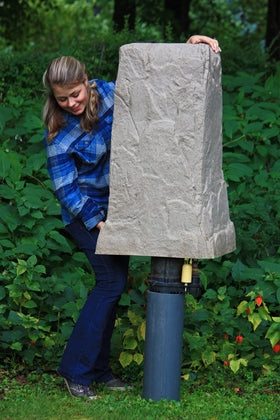 Emsco Group landscape rock tall monolith cover blends with lawns and paths.