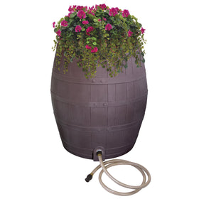 Emsco Group Rescue whiskey rain barrel with planter for growing plants and water savings.