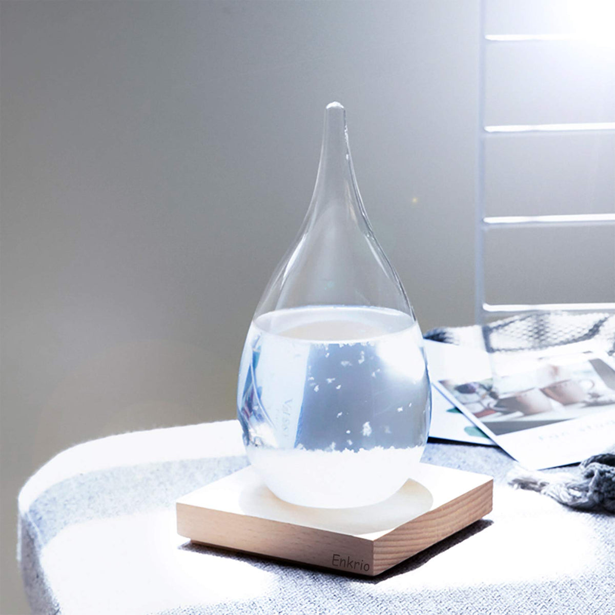 Enkrio storm glass crystal formation visual showcases seasonal changes for stylish office display.