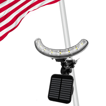 Enrybia flag pole light front view shows bright nighttime flag illumination