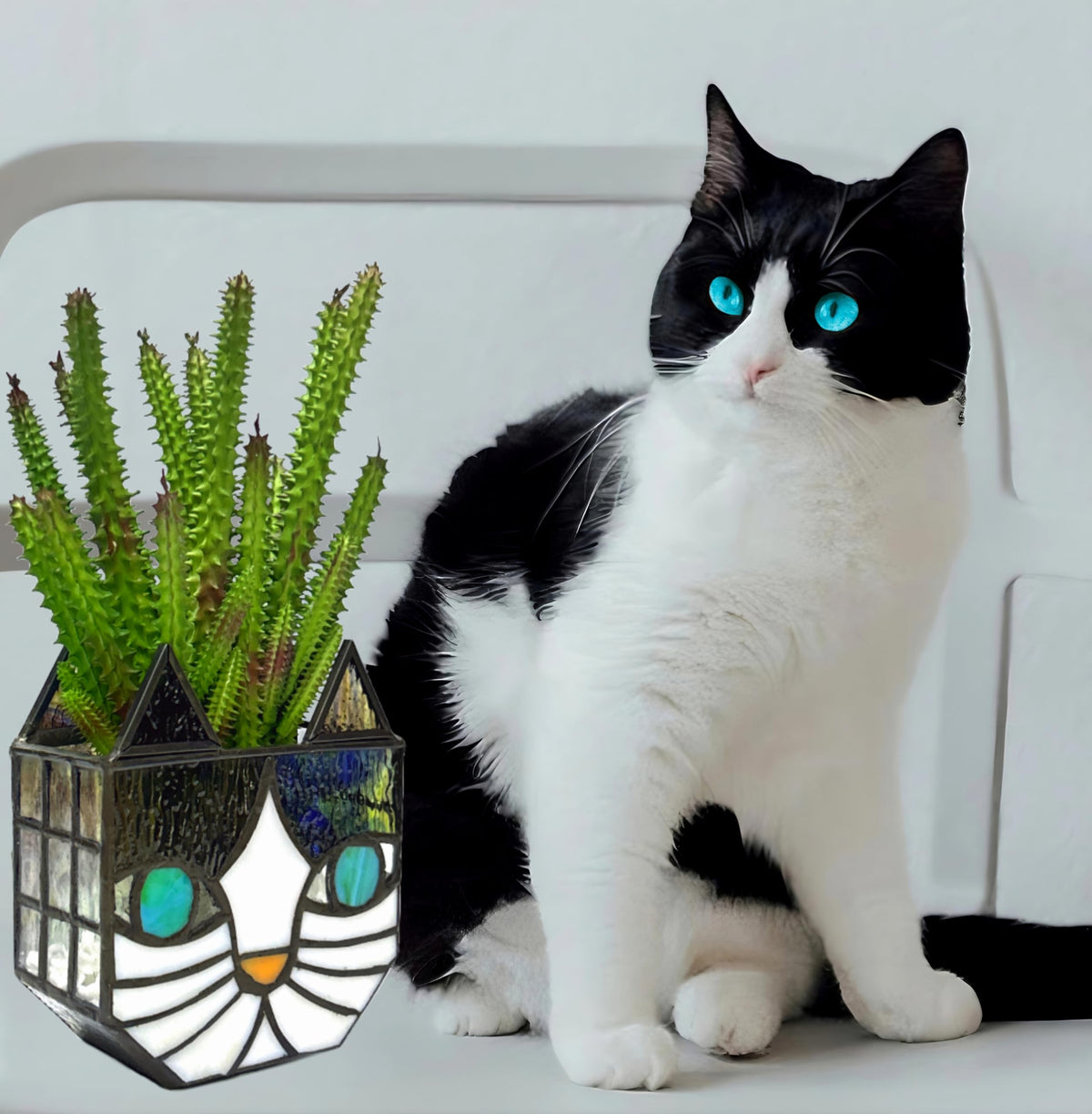 Entlityful Tiffany cat planter side view shows vivid glass colors for decor.