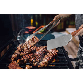 Esie Houzie barbecue serving utensils set in action on grill