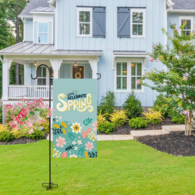 ESTTOP flag stand displayed with baskets and string lights for decor.