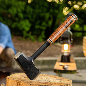 Estwing Fireside Friend Axe in use chopping wood on a campsite