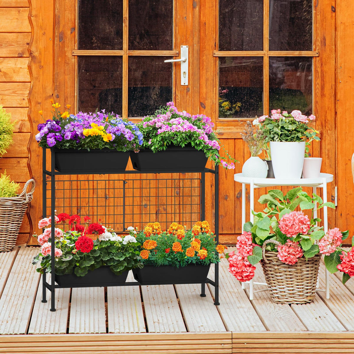 ETELI raised garden bed with metal fence panels for sturdy plant support.