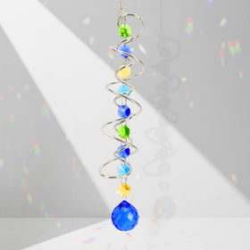 Evechole blue crystal ball with prism and octagonal crystals reflects rainbow light on windows