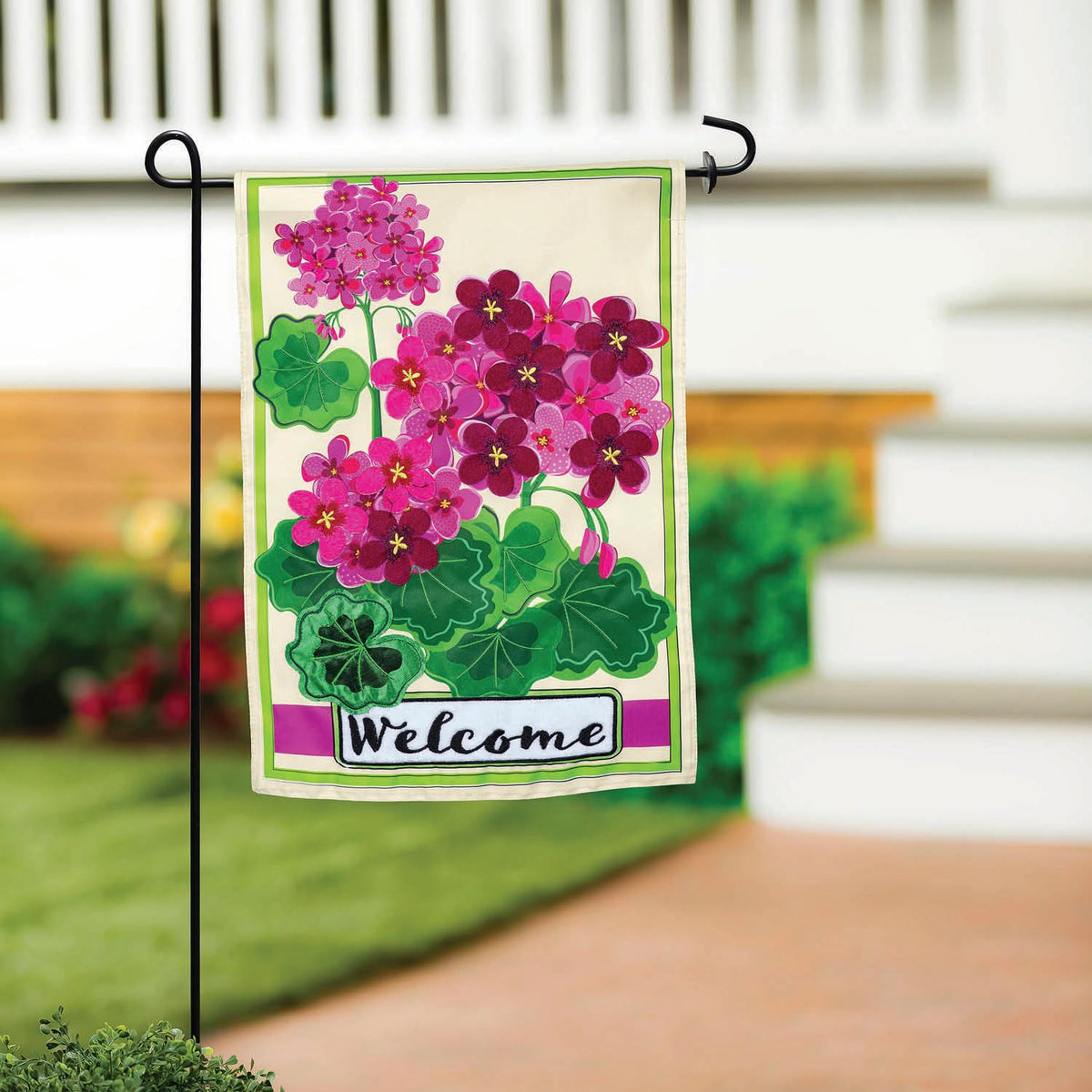 Evergreen Flag pink geranium welcome flag visible from every angle.