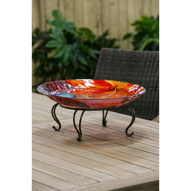 Evergreen Garden dark gold and black pedestal, outdoor-ready for garden or patio display.