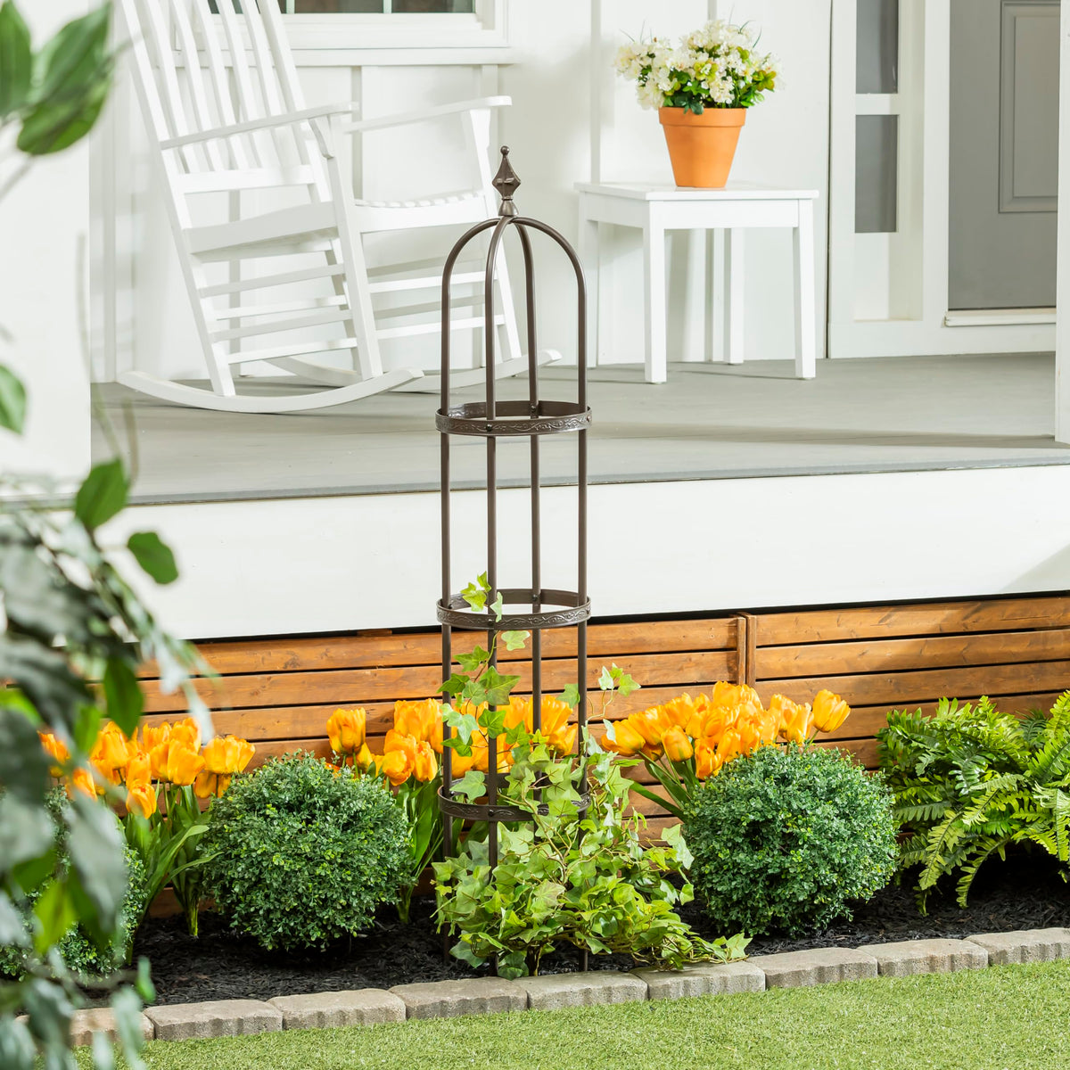 Evergreen Garden floral-pattern band detail adds decorative charm to garden trellis