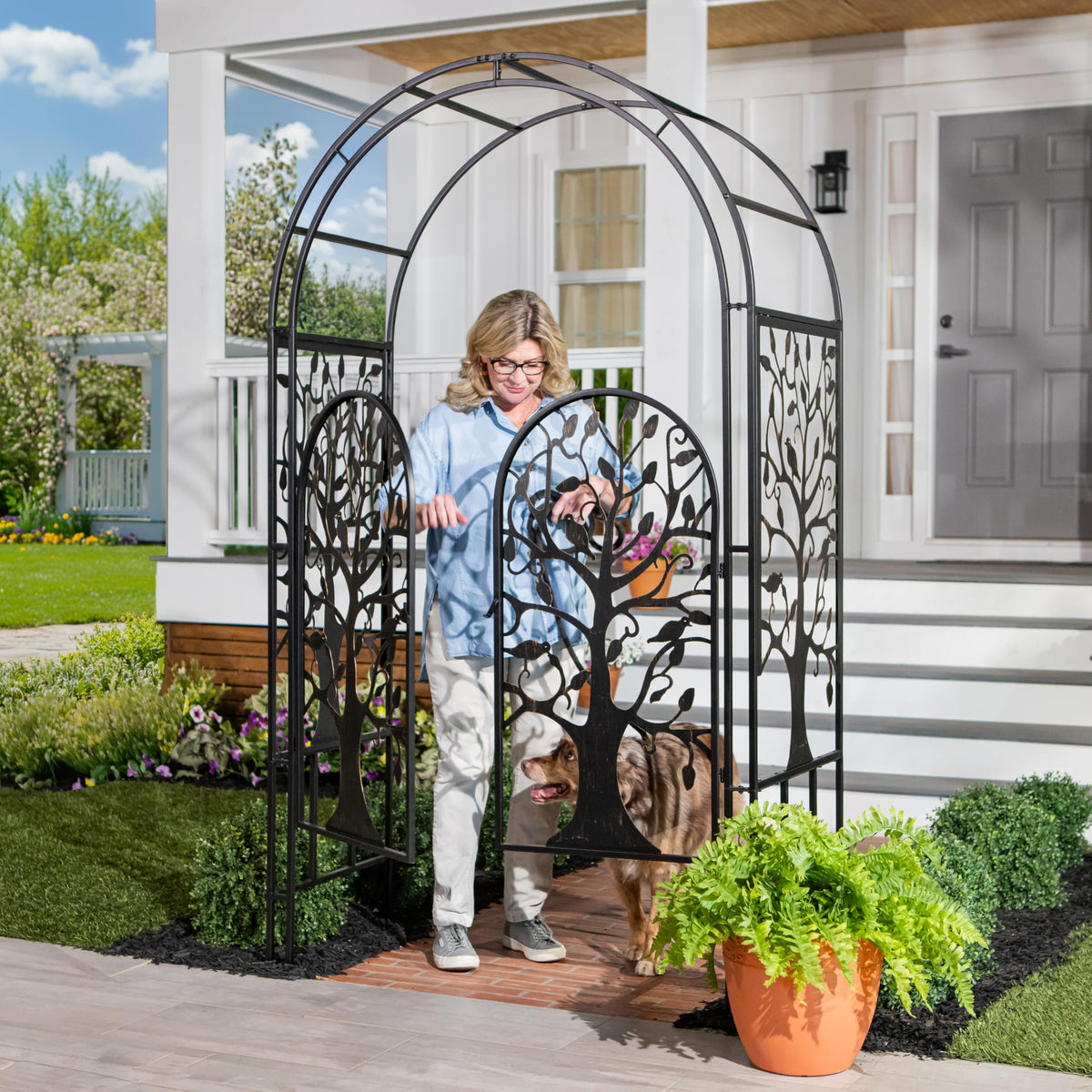Evergreen garden arch with open archway ideal for climbers and seasonal plant displays.