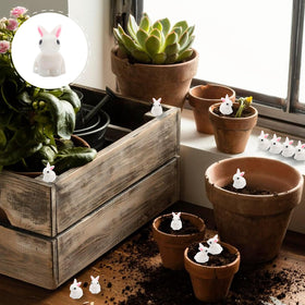 Exasinine fairy garden rabbit ornament brightens pots, terrariums, and decorative fences.