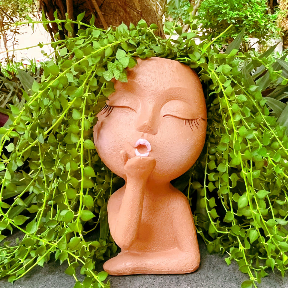 EylbKey brown resin flower pot with drain hole for controlled watering.