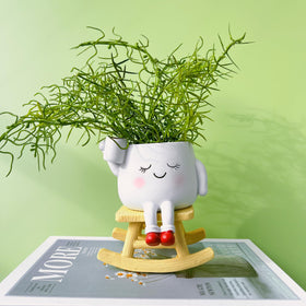 EylbKey resin construction keeps this planter lightweight yet durable indoors or outdoors.