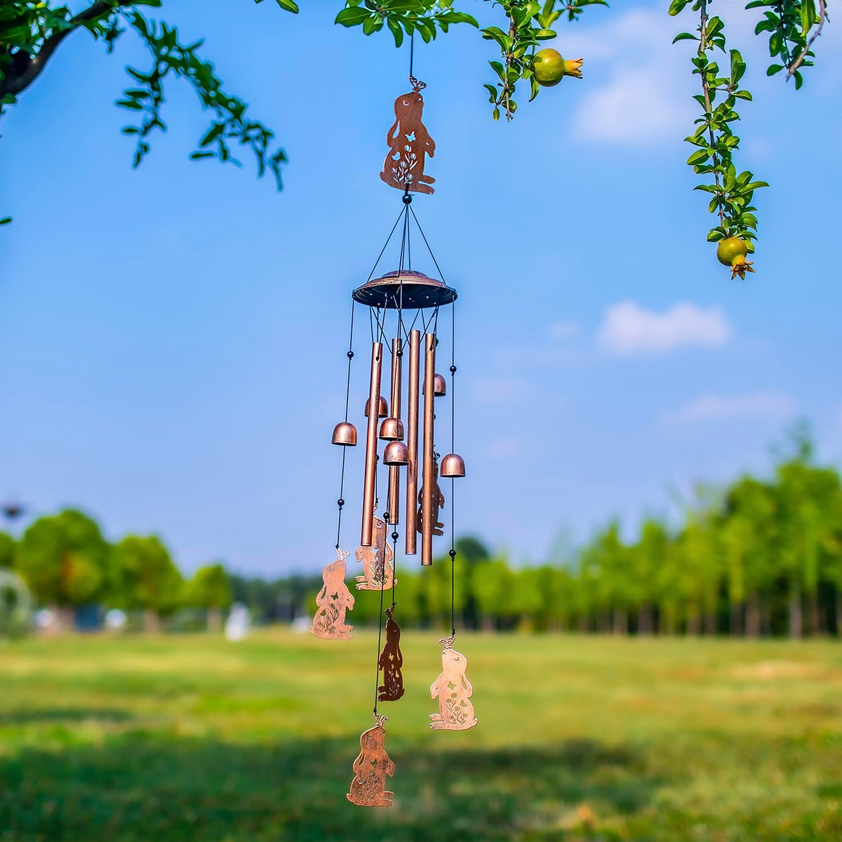 EZTZEN Bunny wind chime hung in a garden courtyard for visual impact.