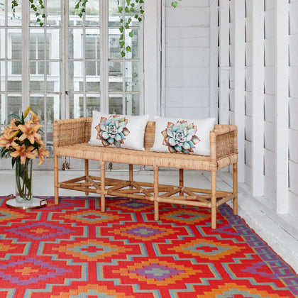 Fab Habitat Lhasa outdoor rug in orange and violet on patio, durable patio decor.
