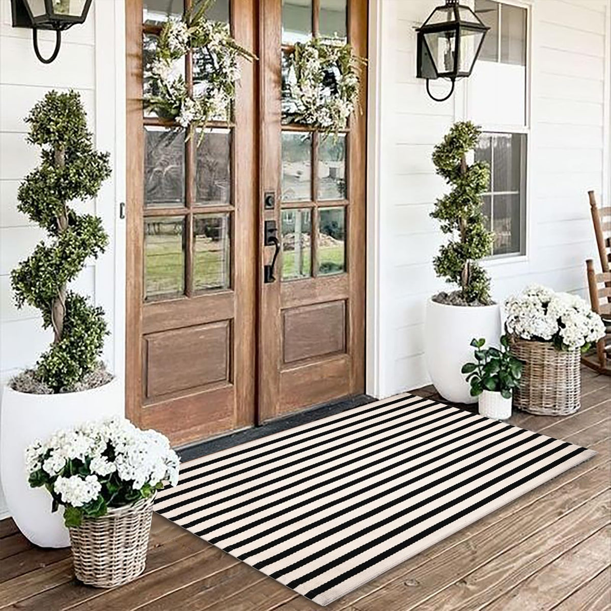 Fallovea black and white striped rug 3x5 on front porch for durable indoor-outdoor use.
