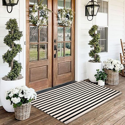 Fallovea black and white striped rug 3x5 on front porch for durable indoor-outdoor use.