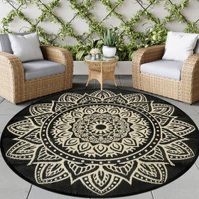 Famibay 6 ft round outdoor rug with recycled straw weave for durable outdoor spaces.
