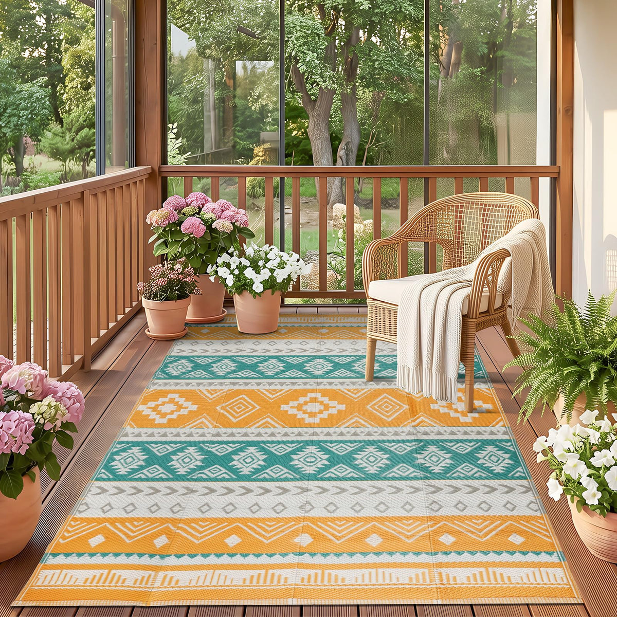 Famibay outdoor rug in yellow boho pattern on patio, durable 5x8 rug for sunny outdoor living