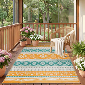 Famibay outdoor rug in yellow boho pattern on patio, durable 5x8 rug for sunny outdoor living