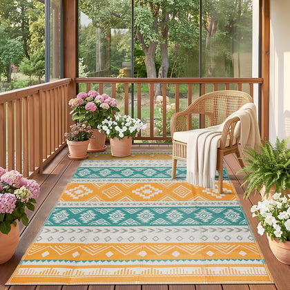 Famibay outdoor rug in yellow boho pattern on patio, durable 5x8 rug for sunny outdoor living