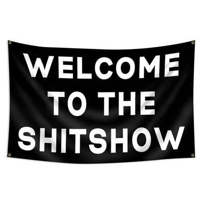 FAMXAKAFLY Shitshow flag hangs in a dorm room, adding playful energy.