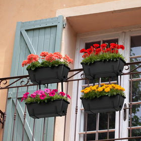 Fansxivita deck railing planter with black stand supports vibrant flowers on a sunny deck