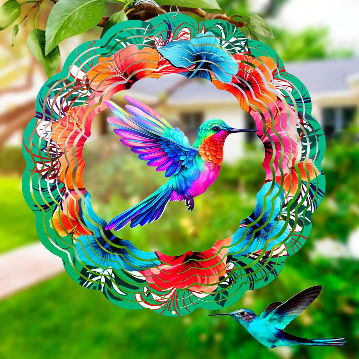 FANTAART hummingbird wind spinner 12-inch diameter spins in sunlight, creating a colorful garden focal point.
