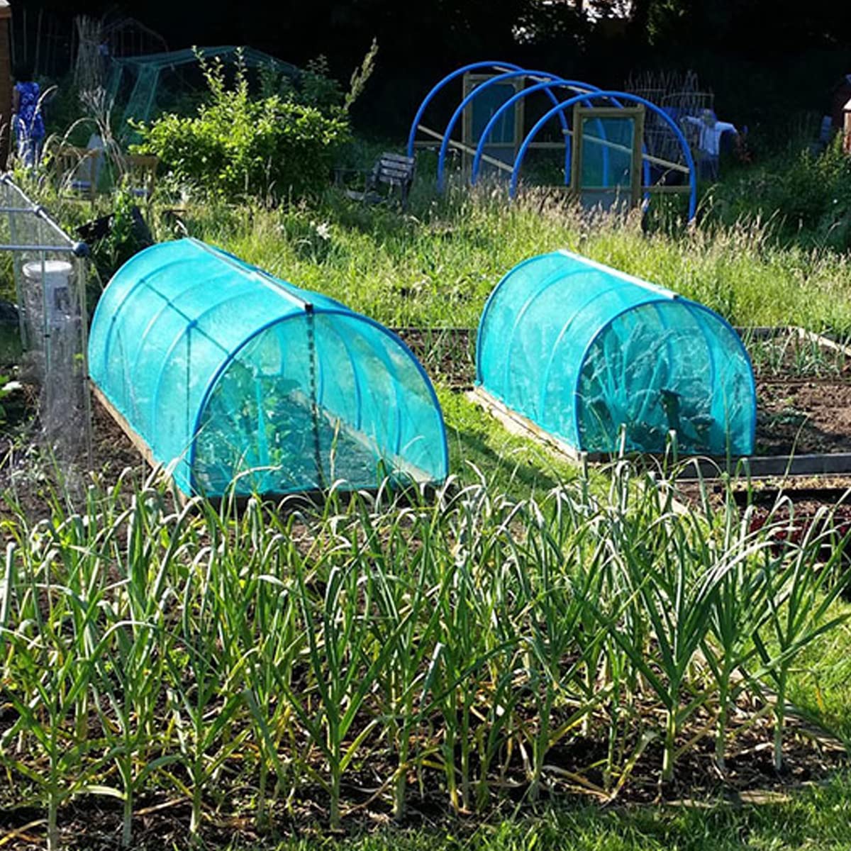 FARAER 10x33 ft green mesh protects crops during harvests.