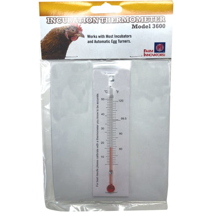 Farm Innovators Model 3600 incubation thermometer atop eggs for precise temperature monitoring.