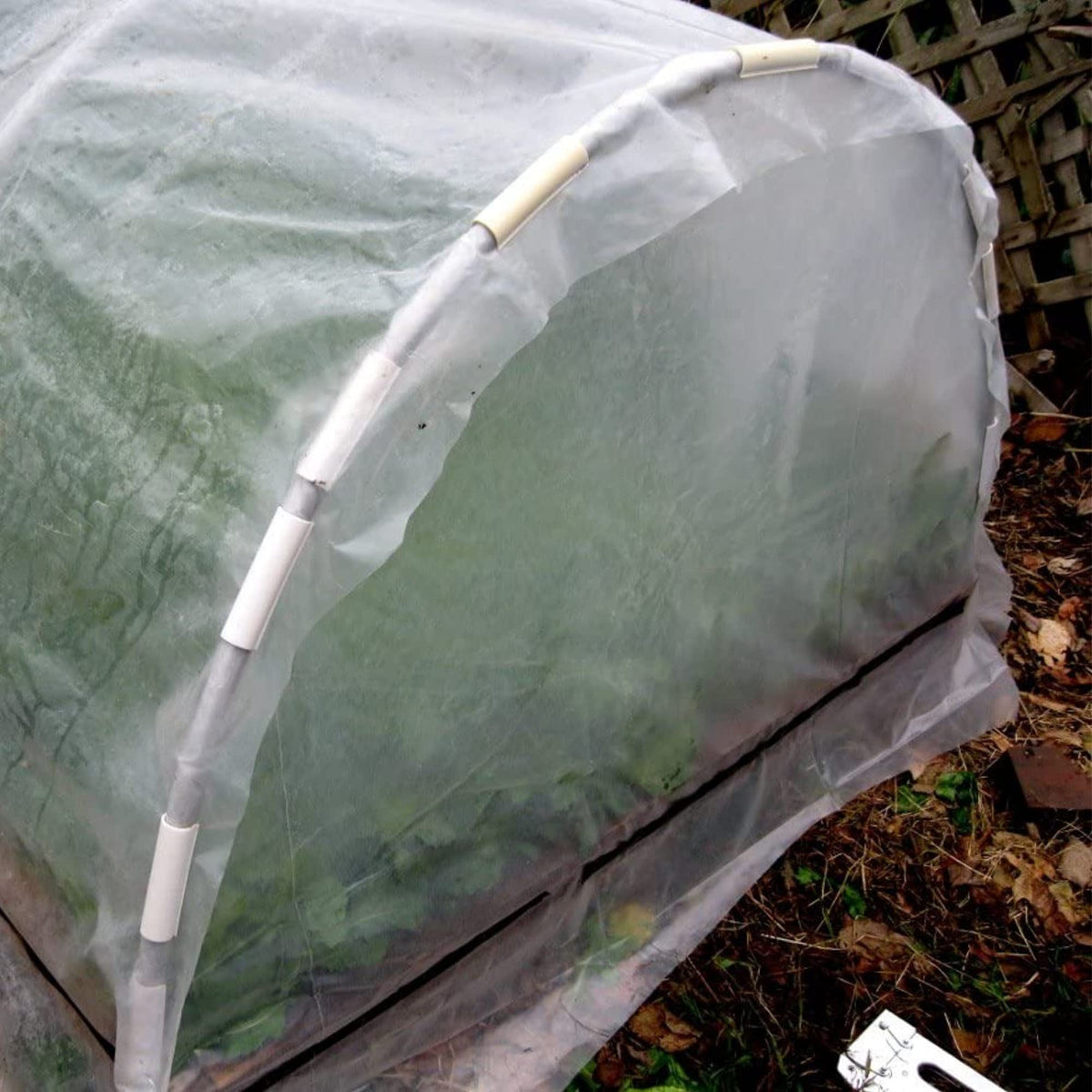 Farm Plastic Supply sun-durable clamp securing tarps and shade cloth outdoors.