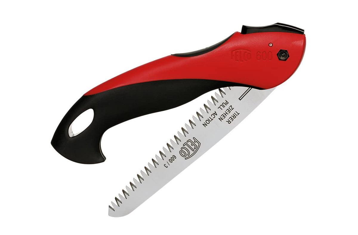 Felco F-600 folding saw with extended blade in action for precise cuts.