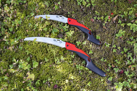 Felco 603 folding saw in pocket for portable pruning on site