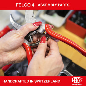 FELCO F4 in use on a branch, illustrating ergonomic design for extended pruning tasks.