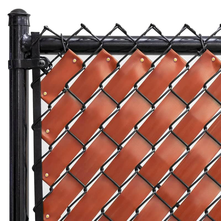 Fenpro Redwood privacy tape on a chain-link fence creates a private outdoor space