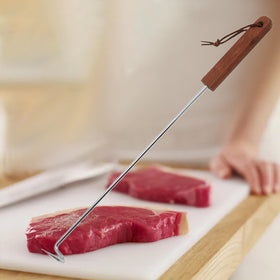 Fenteer BBQ Meat Turner Hook in use delivers confident control.