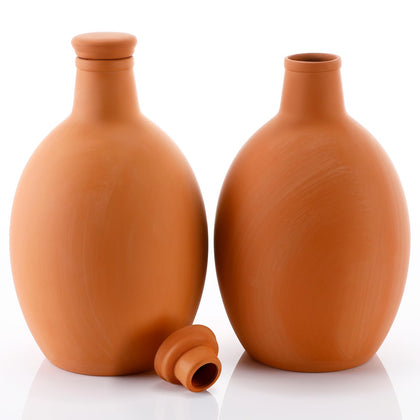 Ferrochef large terracotta watering pot buried in soil for steady root hydration