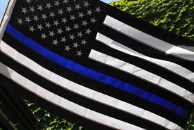 Fine Line Flag reinforced with brass grommets and header for long-lasting use.