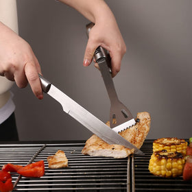 FIRBISI BBQ fork for precise meat turning and control.